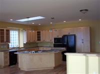 Maple hardwood floors and cabinets in the kitchen